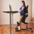 UpmostOffice.com HealthPostures 5100 Stance Angle Sit-Stand Chair, Black, standing position w/ model