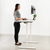 UpmostOffice.com VIVO Electric 60” x 24” Standing  Desk White Top, White Frame w/ Memory Pad, DESK-KIT-1W6W standing pose
