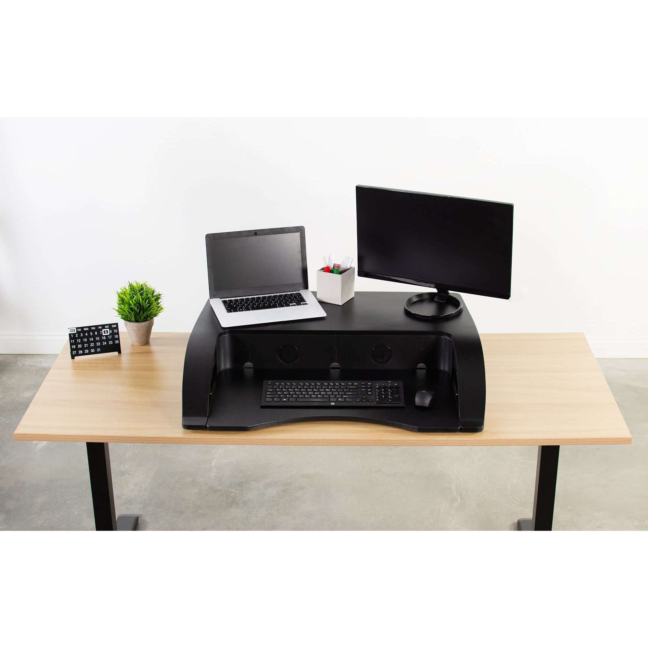 https://www.upmostoffice.com/cdn/shop/products/vivo-black-36-elegant-height-adjustable-desk-converter-sit-stand-monitor-riser-desk-v000r-upliftofficecom-28706682@2x.jpg?v=1611298304
