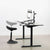 UpmostOffice.com CHAIR-S01P Black Height-Adjustable Mobile Perch Stool setup w/ desk